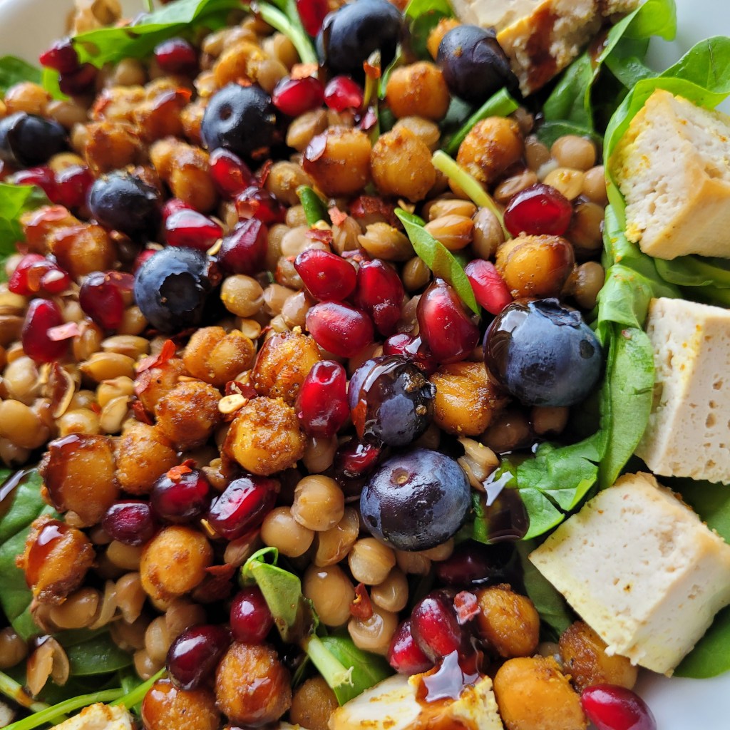chickpea, blueberry, pomegranate, tofu and spinach salad
