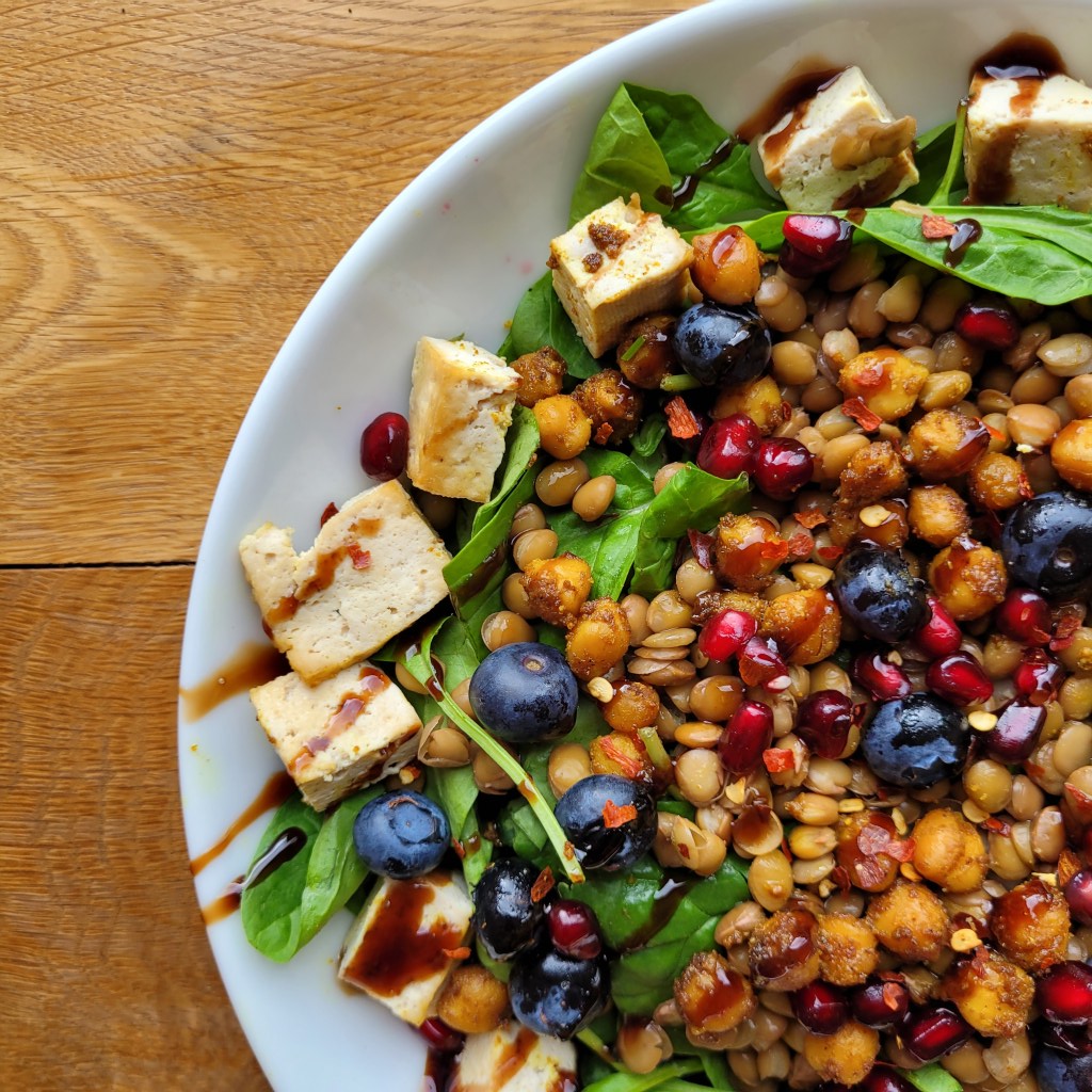 chickpea, blueberry, pomegranate, tofu and spinach salad
