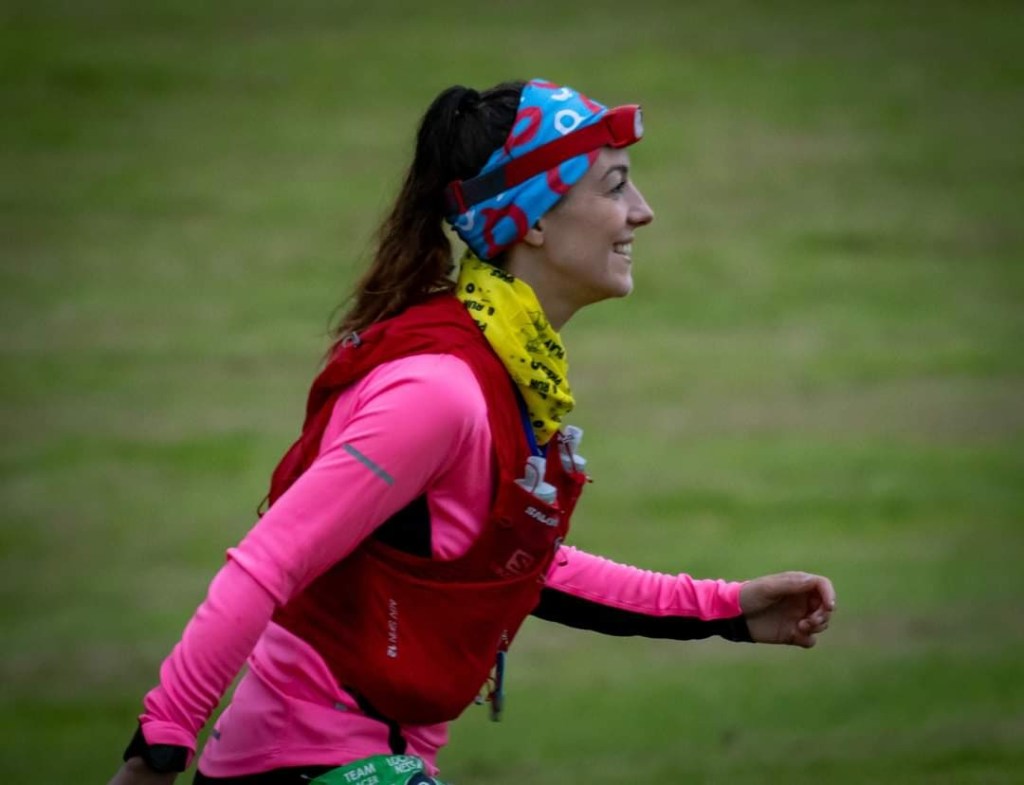 a brightly coloured runner heading out for a night time loop at Loch Ness 24