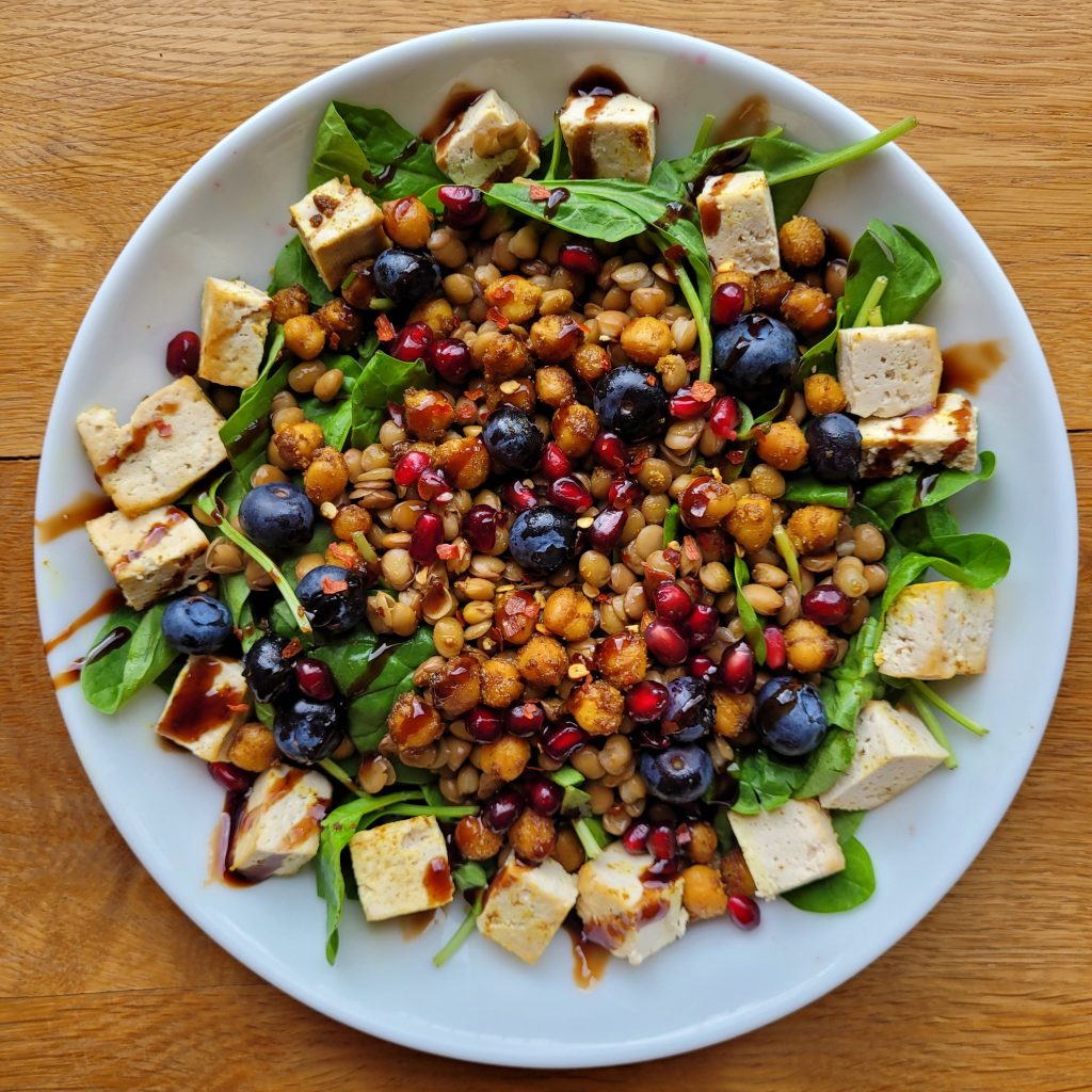 chickpea, blueberry, pomegranate, tofu and spinach salad