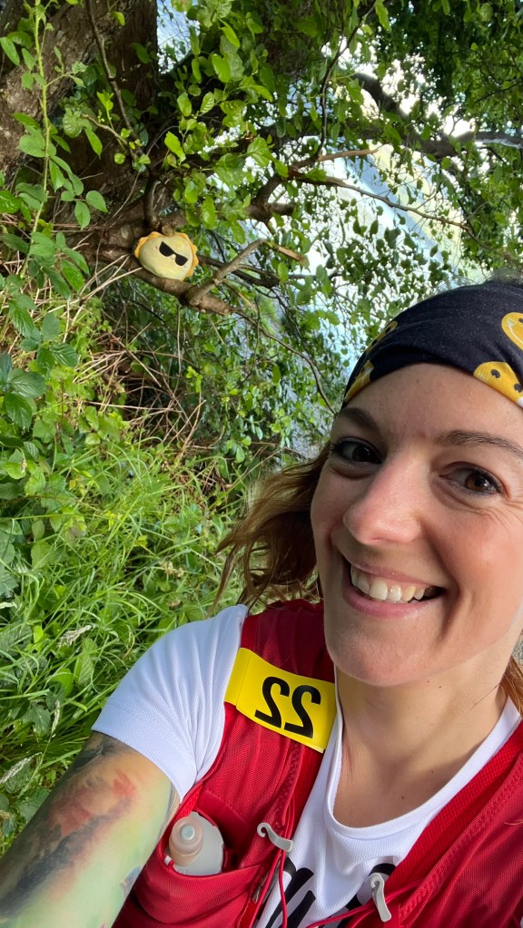 a selfie with a plushie in a tree