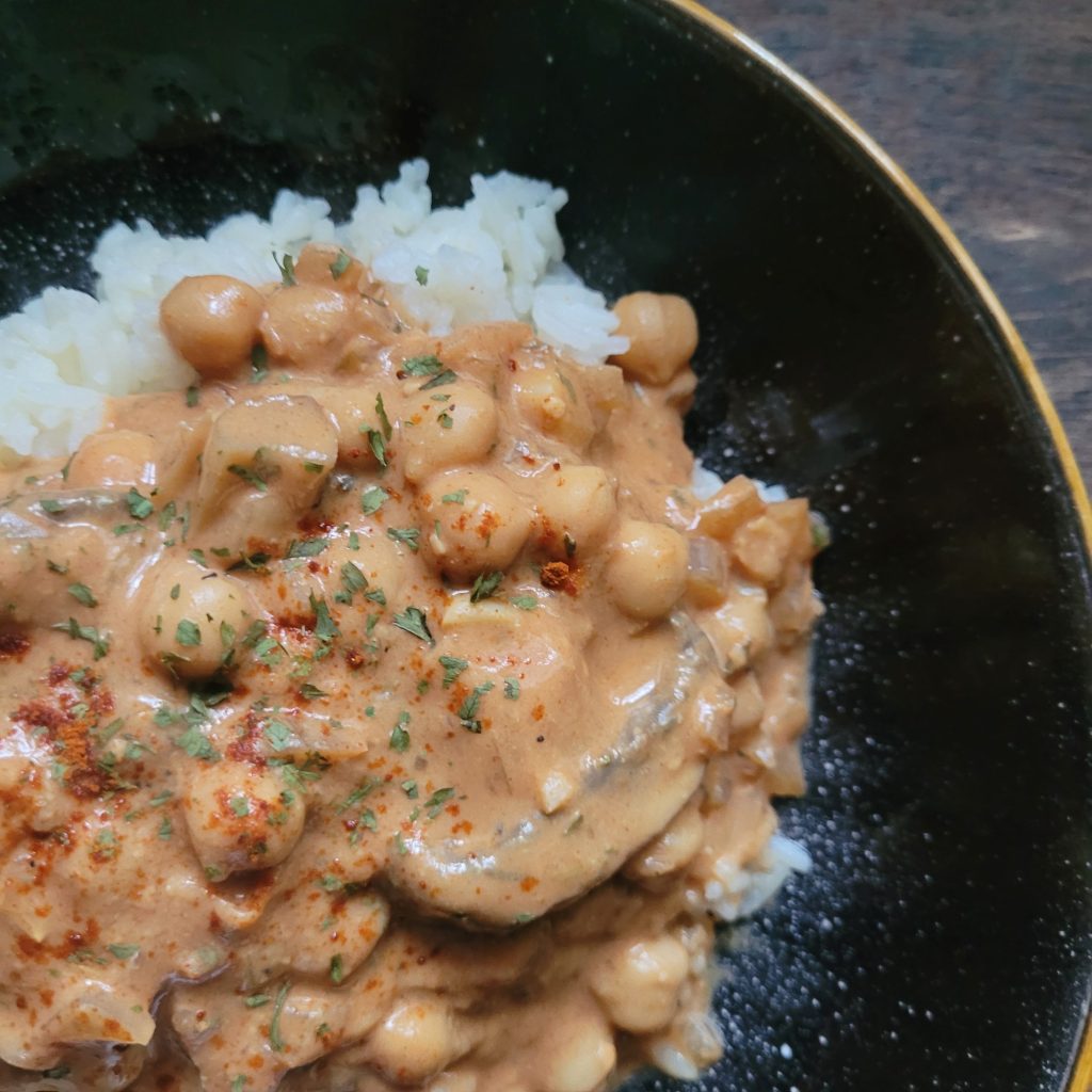 A chickpea coconut curry and rice in a bowl